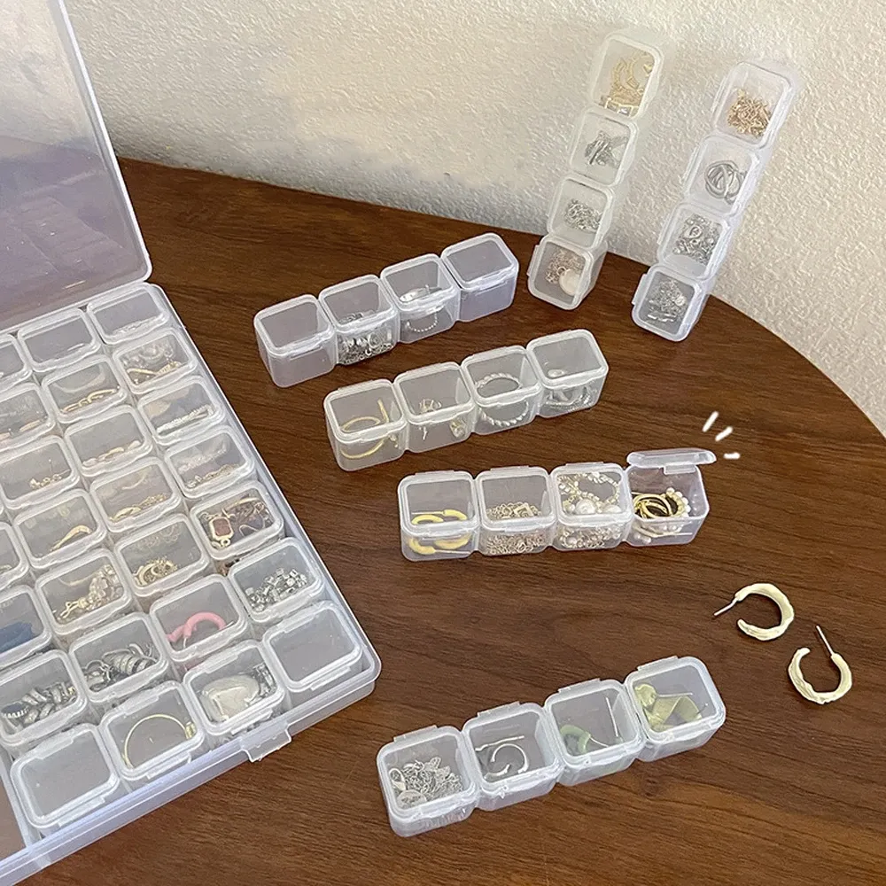 Boîte de rangement plastique à 28 grilles pour bijoux